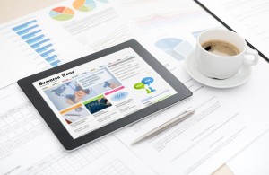 Modern digital tablet with business media website on a <a href=
